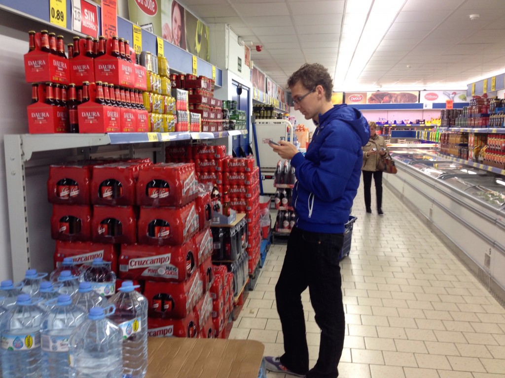 Here's Kevin at the Lidl Supermercado, our grocery store of choice. Kevin's doing what he always does, seeking out each country's best rated and best value beers!