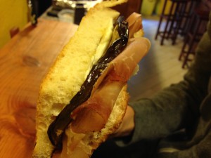 Speck, Mozzarella, and Roasted Eggplant on Olive Oil Bread.
